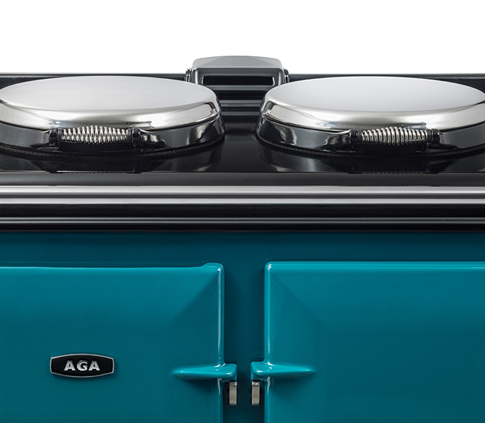 AGA in a Salcombe Blue top showing close-up of AGA logo.