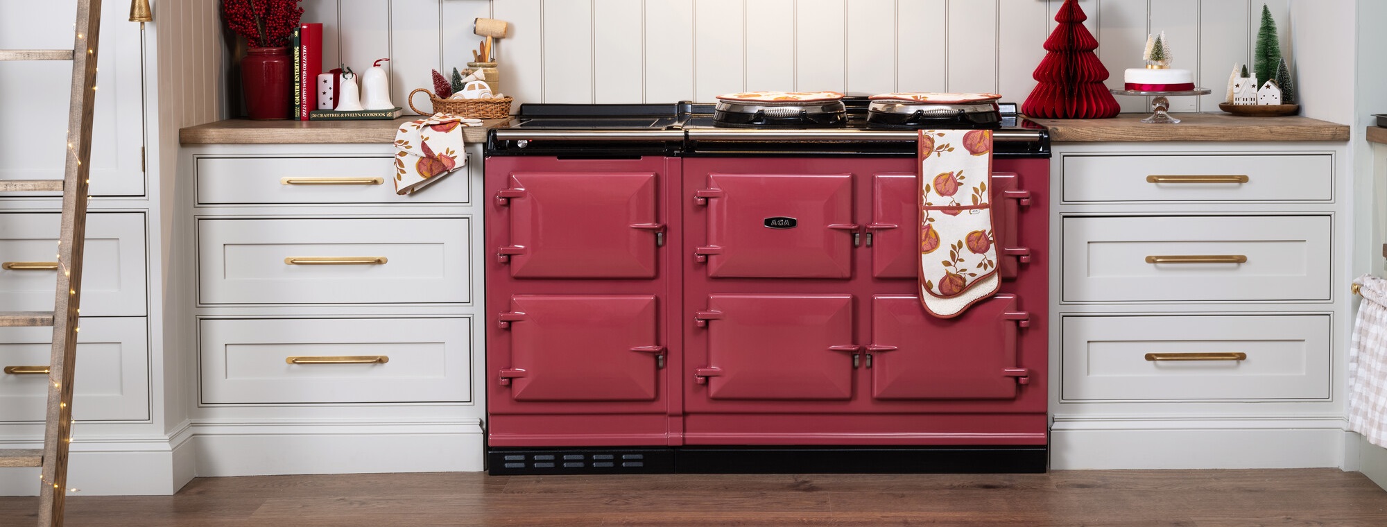 AGA eR7 150 in Raspberry finish in an off-white kitchen with wood work tops.